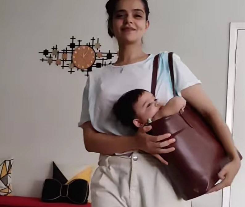 Srha Asghar puts baby in handbag