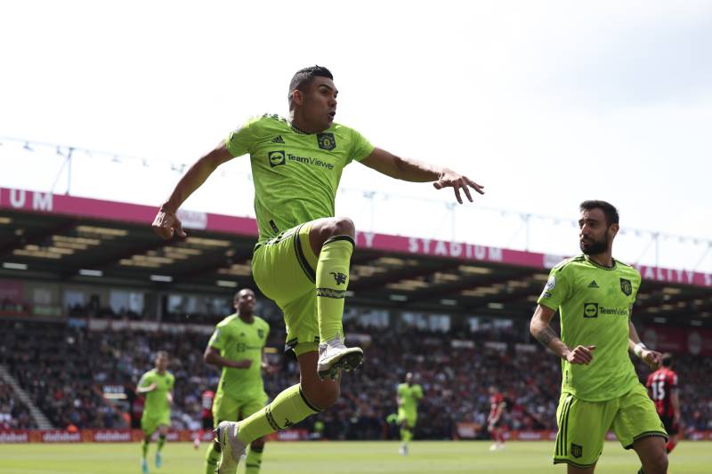 Manchester United's Brazilian midfielder Casemiro (C) celebrates after scoring the opening goal during the English Premier League football match between Bournemouth and Manchester United at the Vitality Stadium in Bournemouth, southern England on May 20, 2023. AFP 