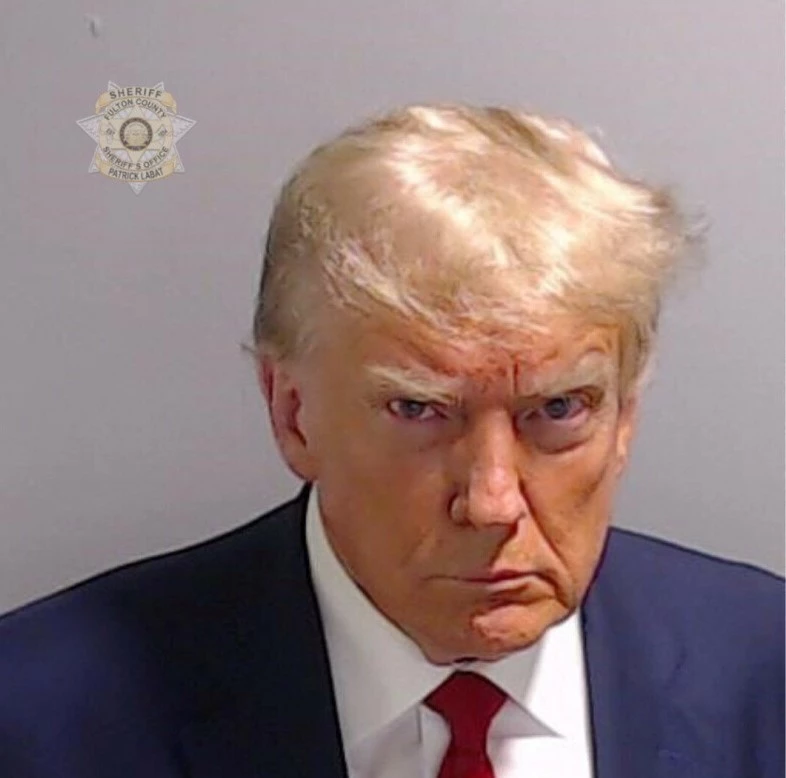 Trump arrested, released in election case; mug shot released