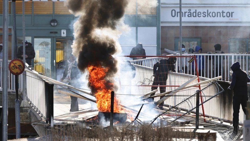 Swedish police arrest two as riot breaks out at Koran burning protest