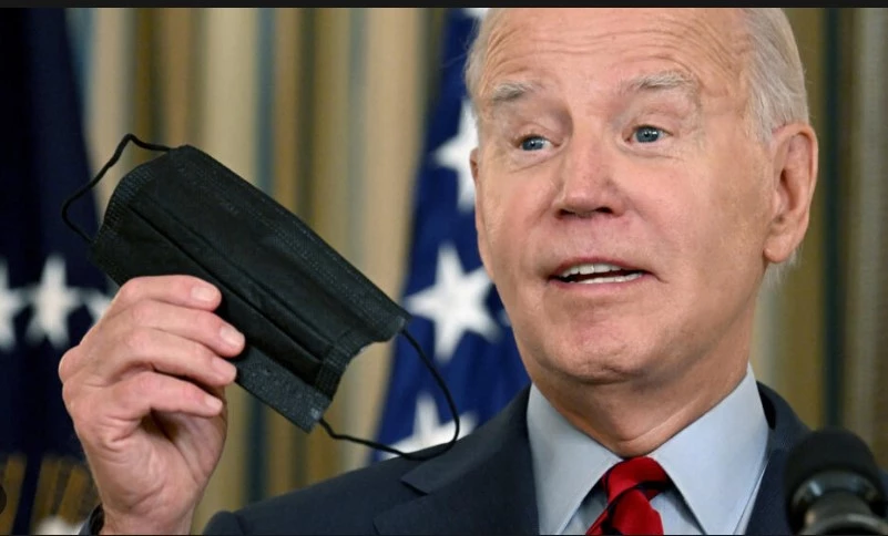 Maskless Biden laughs off Covid guidance