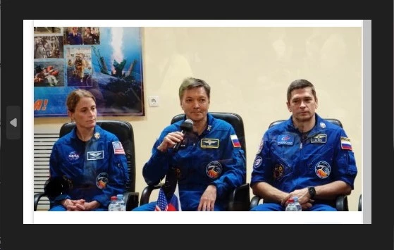 Two Russians, one American rocket toward space station