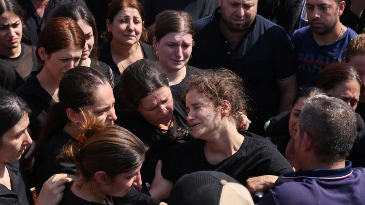 Grief, anger at Iraq mass for victims of wedding fire