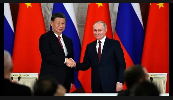 Putin in China to meet 'dear friend' Xi