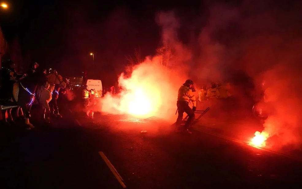 Dozens of men charged after Villa Park clashes