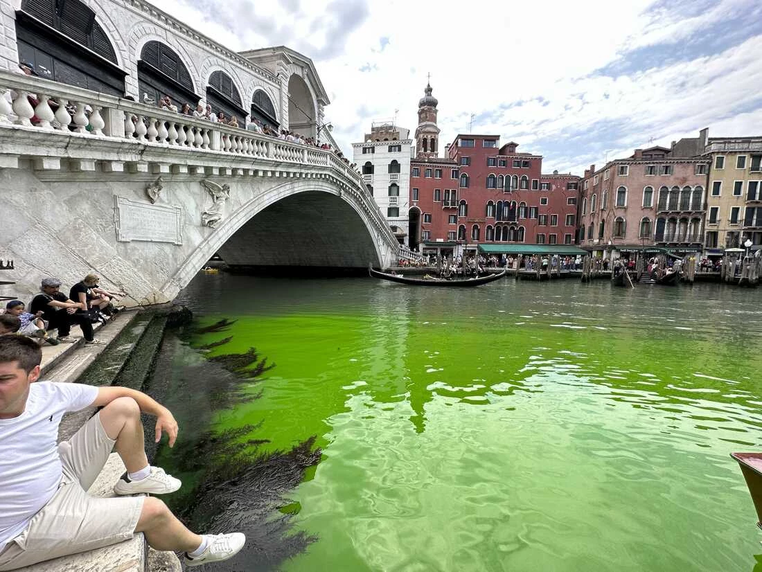 Environmental activists pour green dye in Venice canal