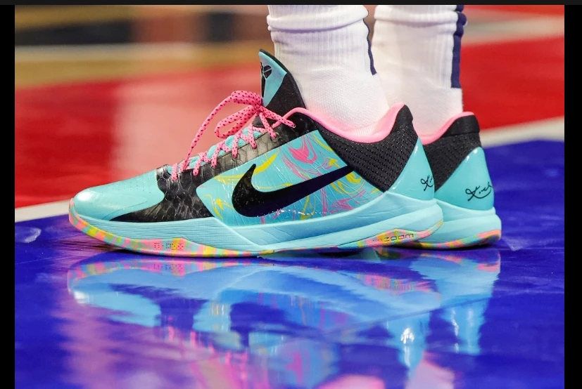 Nike shares tumble as it cuts costs amid 'softer' outlook