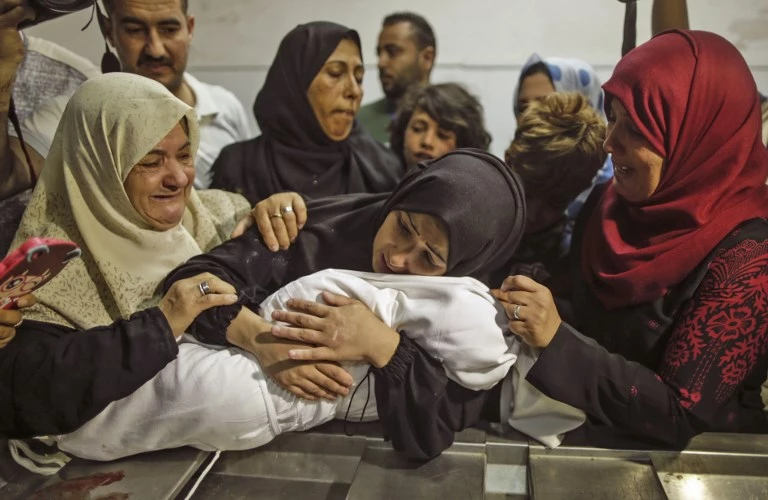 Health ministry in Hamas-run Gaza says 21,672 killed in war