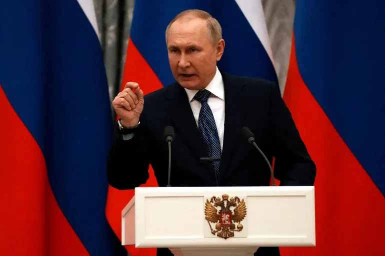 Putin says 'we will never back down' in New Year's Eve address