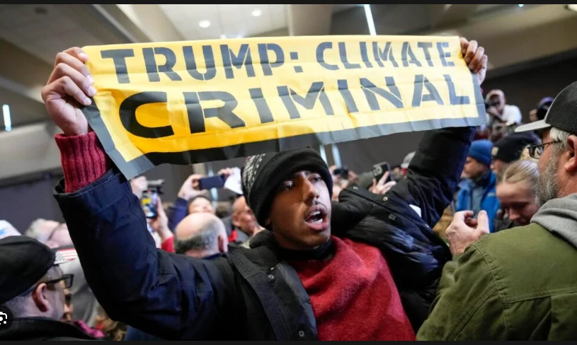 Climate protesters interrupt Trump event in Iowa