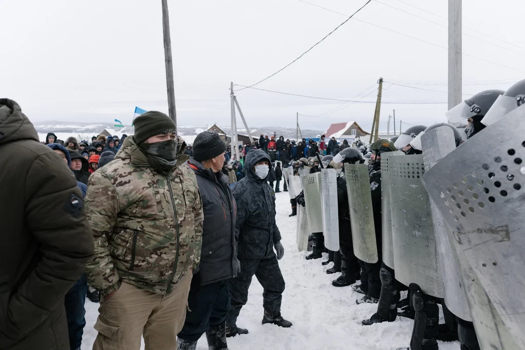 Russia arrests four after rare protests