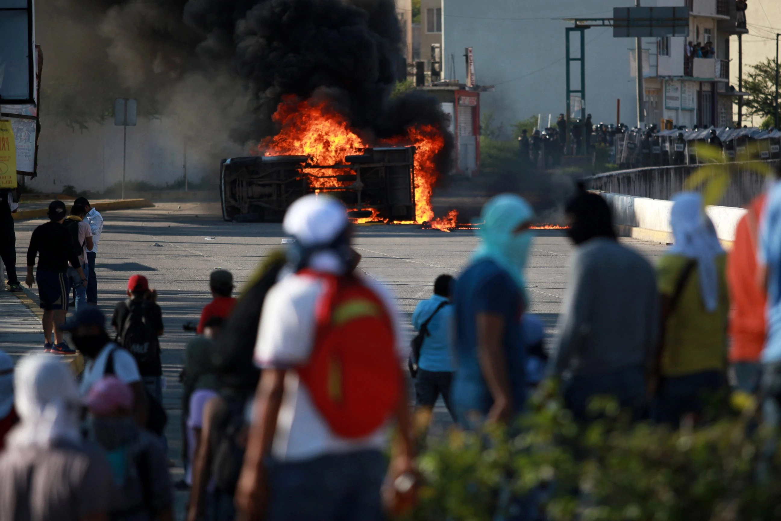 Protesters set fire to two patrol cars in southern Mexico