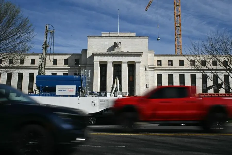 US Fed holds key rate, pencils in 3 cuts this year