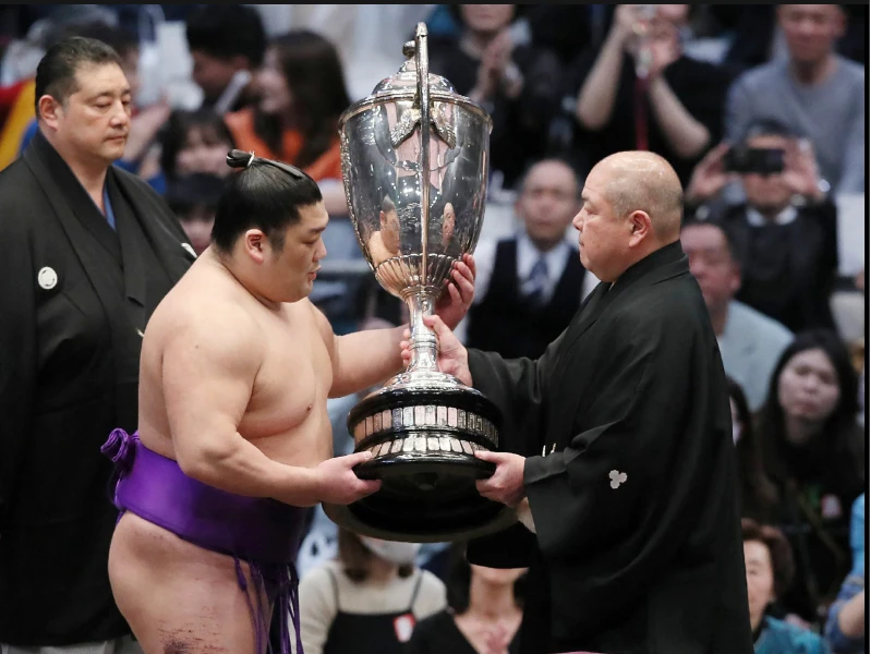 Rookie makes sumo history after winning top tournament