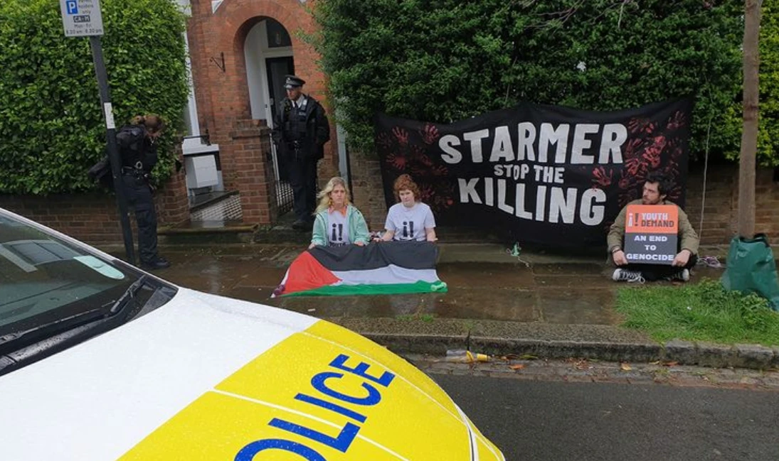 UK police charge 3 over protest outside party leader's home