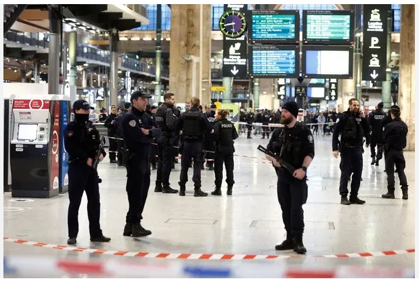 Man shoots 2 officers in Paris police station after grabbing gun