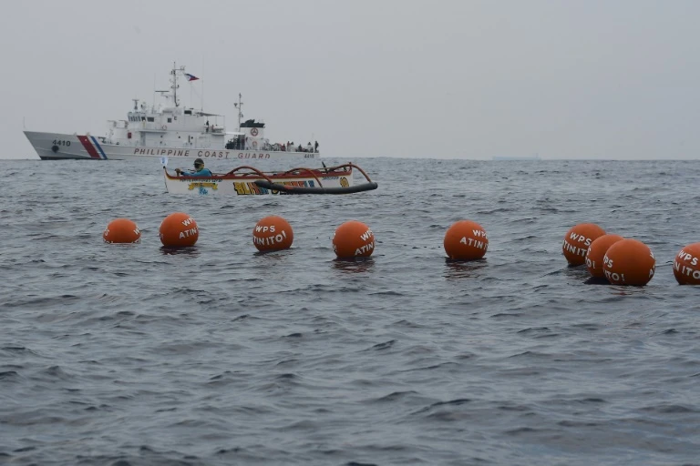 Philippine boats sail towards disputed reef despite China warning
