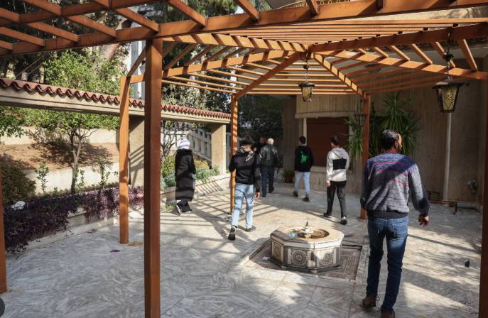 Syrians explore ousted Assad's Damascus home