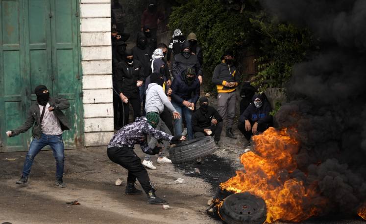 Tensions flare at funeral in West Bank after clashes