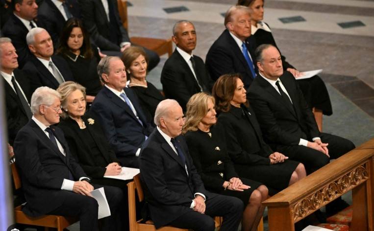 Jimmy Carter briefly unites US as presidents attend funeral