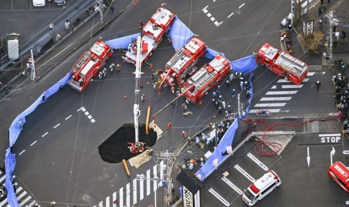 Japan trucker still stuck in sinkhole after 24 hours