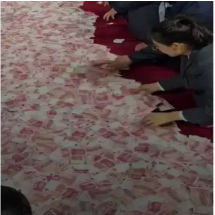 Chinese company puts $11m on table, asks workers to take away as much as they can!