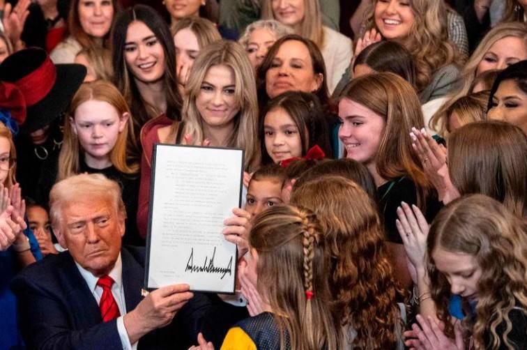 Trump signs order barring trans athletes from women's sports