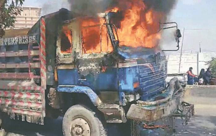 Two goods trucks torched in Karachi