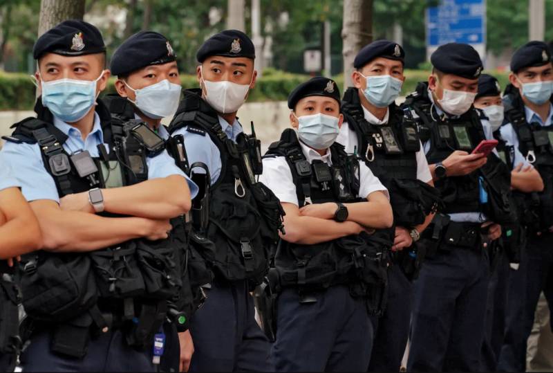 Hong Kong police defend probing family of wanted democracy activists