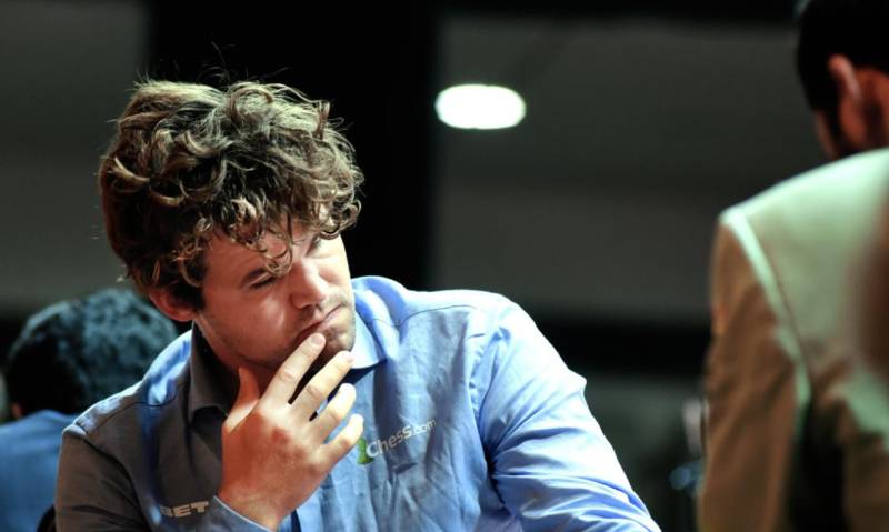 Chess legend Carlsen puts 'forbidden jeans' up for auction