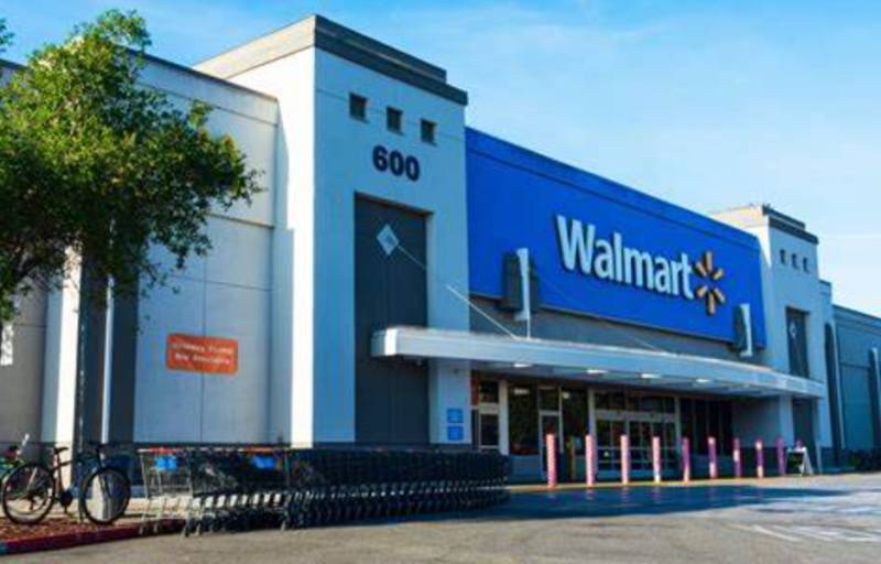 Walmart sales rise but shares tumble on forecast