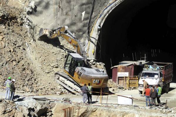 Rescuers search for eight trapped in India tunnel collapse