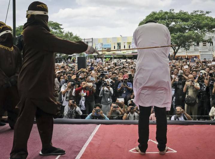 Indonesian men sentenced to public flogging for gay sex