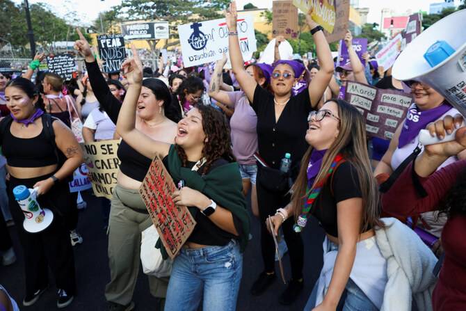 Protesters rally on International Women's Day, fearing far right