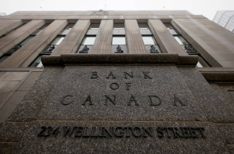 Canada central bank cuts key rate but flags US trade tensions 