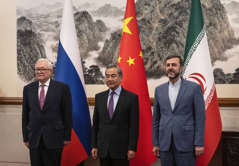 China urges end to 'illegal' sanctions as it hosts Iran nuclear talks 
