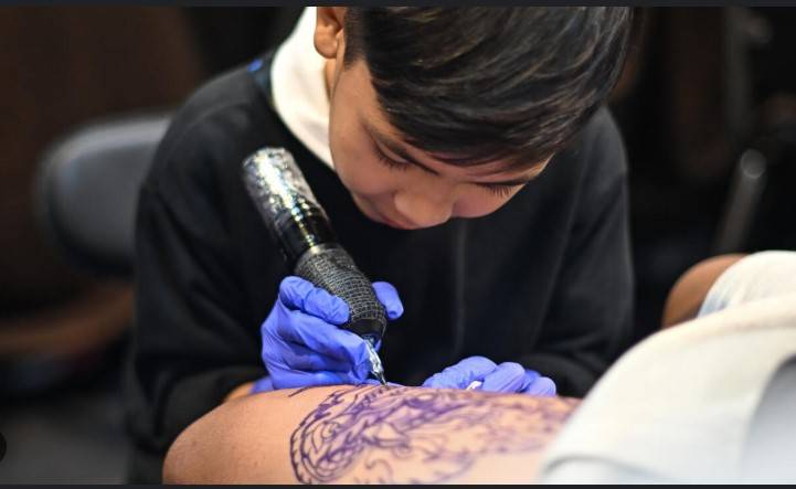 Nine-year-old Thai tattooist makes his mark