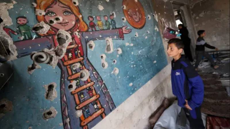 Nine children among 19 dead in Israel strike on UN building