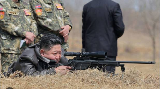 North Korea's Kim fires new sniper rifle while visiting troops