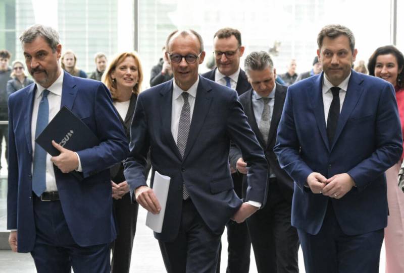 Germany 'back on track' says Merz, unveiling new coalition