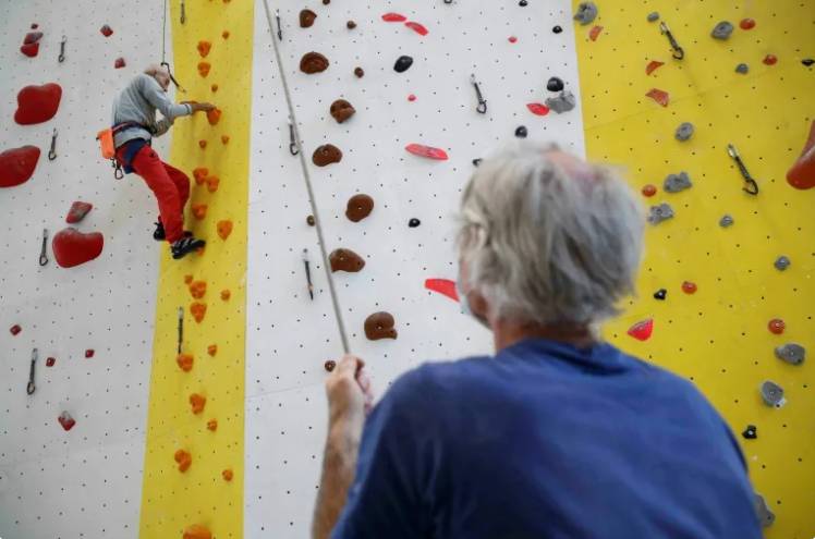 Teenage migrants overcome trauma up Paris climbing wall