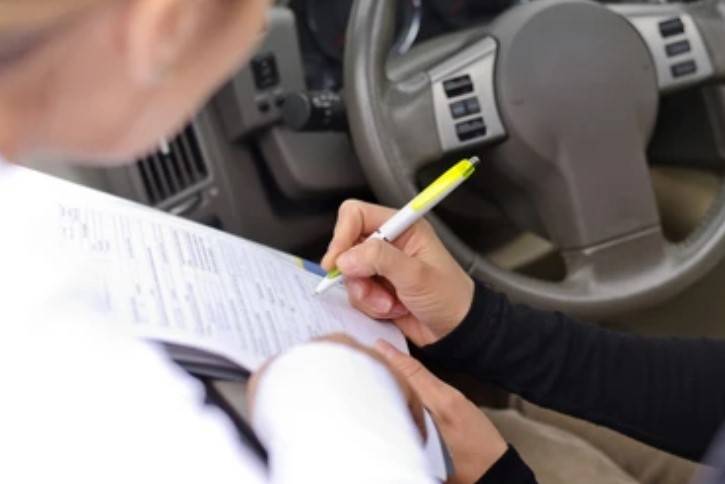 Lahore student caught solving 9th class paper in car