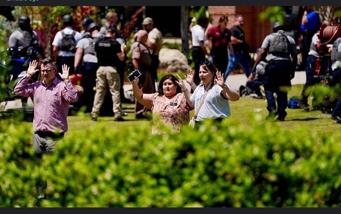 Two dead as police officer's son opens fire at US university