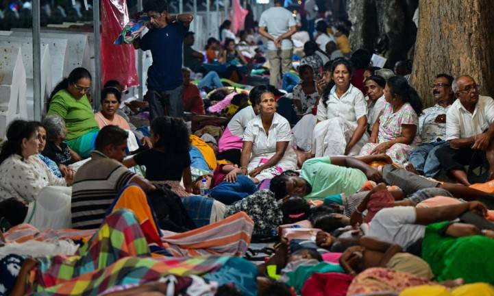 Sri Lankans throng to Kandy for rare display of Buddhist relic