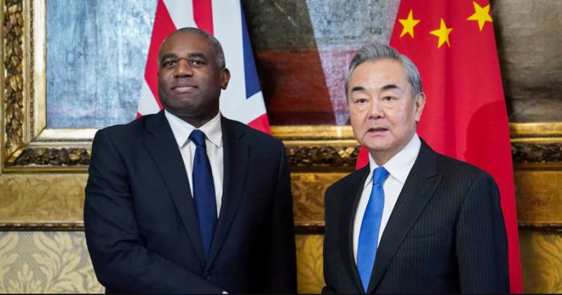 China FM calls on UK, EU to help defend global trade