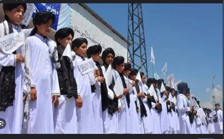 Afghan students don Taliban-imposed uniforms