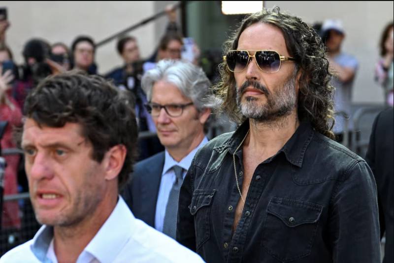 UK comedian Russell Brand appears in court on rape charges