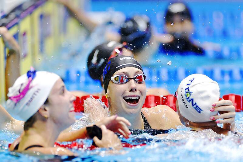 Walsh sets 100m butterfly world record