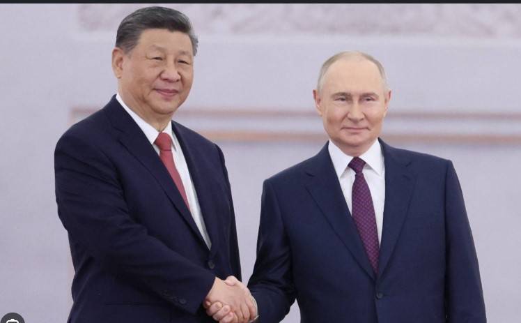 Xi meets Putin in Moscow as Ukraine reports truce violations