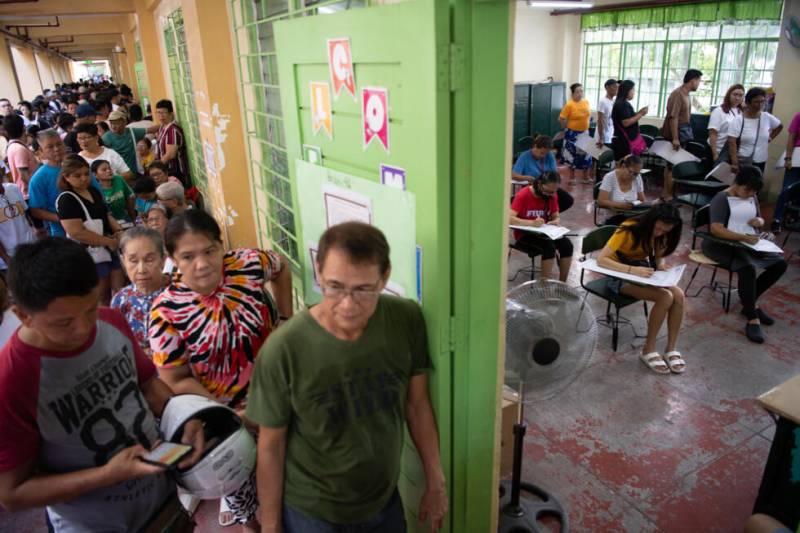 Sweltering Philippines votes with Marcos-Duterte feud centre stage